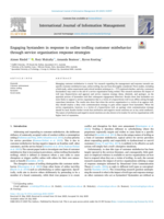 Engaging bystanders in response to online trolling customer misbehavior through service organization response strategies