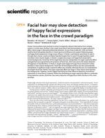 Facial hair may slow detection of happy facial expressions in the